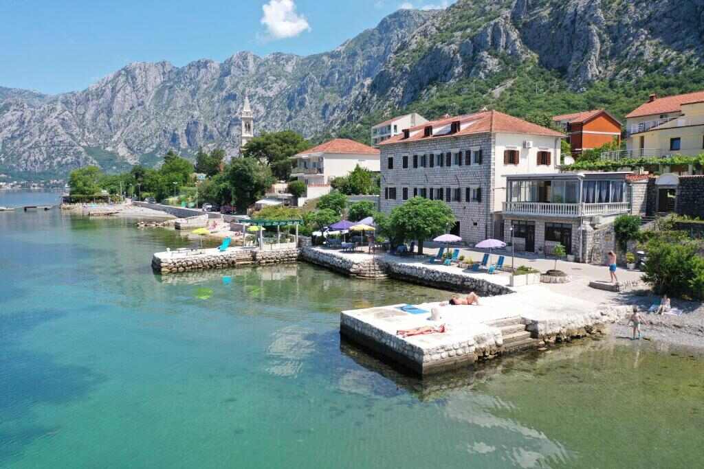 Aerial view of Garni hotel Pana-Eustahije 253 and its private pier in Dobrota